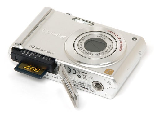 Panasonic Lumix DMC-FS20 camera with open memory card slot.