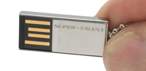 Super Talent Pico USB Flash Drive 8GB held between fingersHand holding Super Talent Pico USB Flash Drive 8GB.