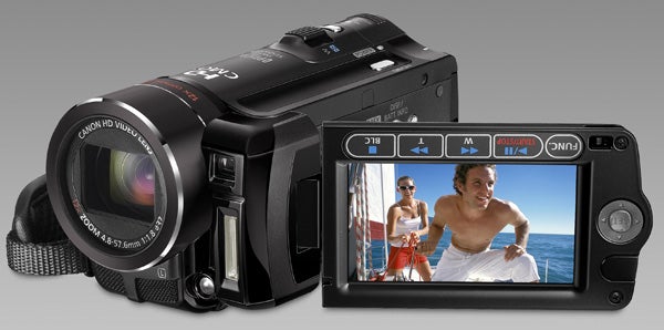 Canon HF10 camcorder with flip-out LCD screen displaying video.