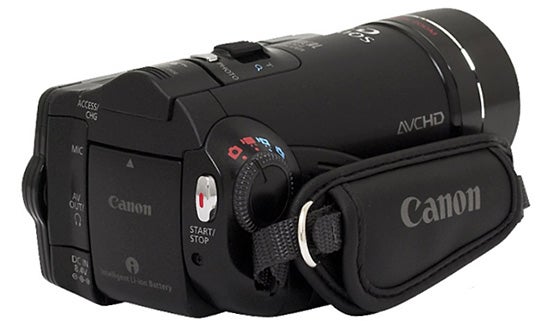 Canon HF10 camcorder with strap on white background.Canon HF10 camcorder with hand strap and controls.