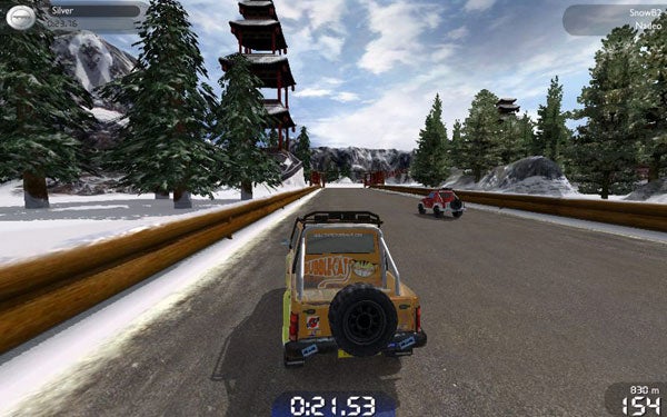 Screenshot of a car racing in TrackMania United Forever game.Screenshot of a snowy race track in TrackMania United Forever.