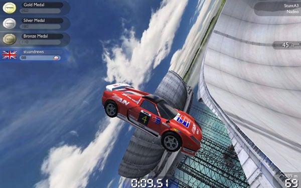 TrackMania United Forever gameplay screenshot with racing car mid-air.Screenshot of a car jumping in TrackMania United Forever game.