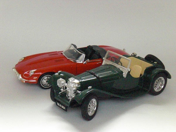 Two vintage model cars photographed by Casio Exilim EX-Z80.Toy model cars photographed with a digital camera