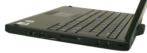Dell Latitude XT Tablet PC side view showing ports and keyboard.Dell Latitude XT Tablet PC with keyboard and ports visible.