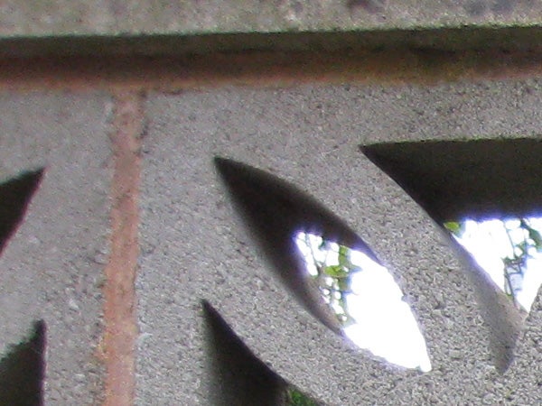 close-up of a textured surface with triangular cutouts.image of a wall with triangular cutouts.