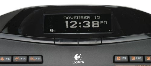 Logitech MX 5500 keyboard with LCD displaying date and time.