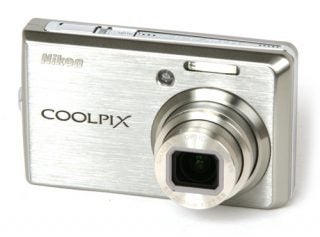 Nikon CoolPix S600 digital camera on white background.