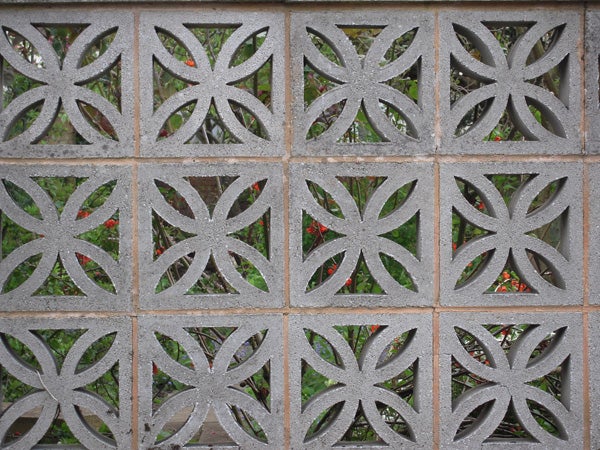 Decorative concrete block wall with floral patternsDecorative concrete block wall with geometric patterns