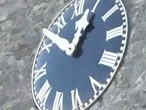 photo of a clock face taken with Fujifilm Finepix F100fd.Fujifilm Finepix F100fd sample photo of a clock.
