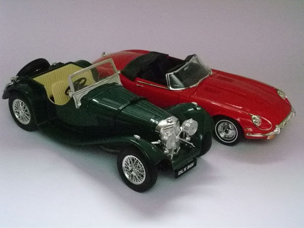 Vintage green and red model cars on displayGreen and red vintage model cars on a table.