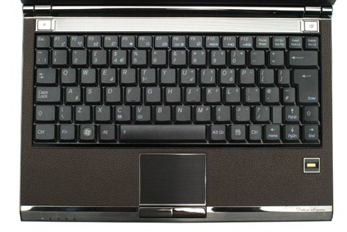 Asus U2E Notebook keyboard and touchpad close-up.Asus U2E notebook with black keyboard and leather palm rest.