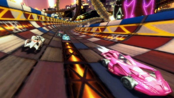 Speed Racer video game screenshot with racing cars on track.Speed Racer cars racing on a vibrant, cartoon-style track.