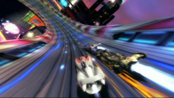 Speed Racer vehicles racing on futuristic track.race cars on colorful, futuristic racetrack.