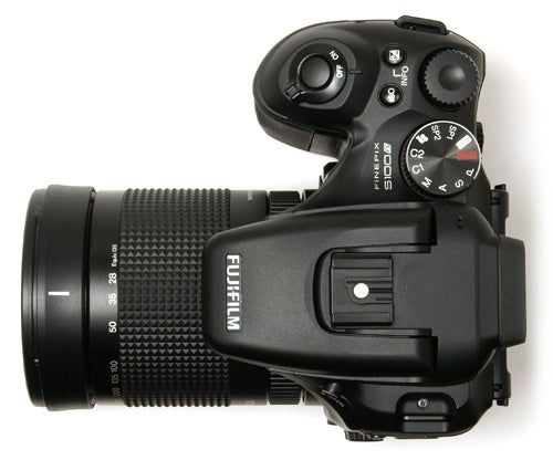 Fujifilm FinePix S100FS camera with lens on white background.Fujifilm FinePix S100FS camera with zoom lens.