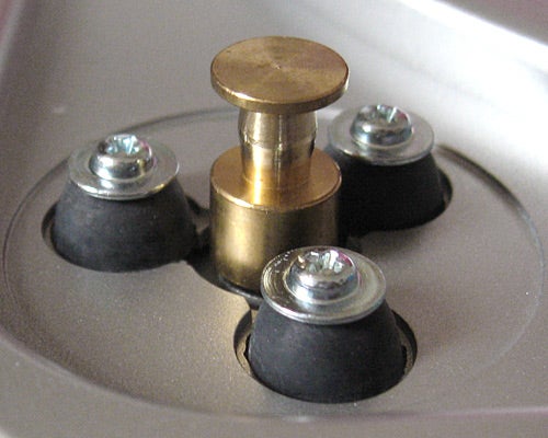 Close-up of ION Audio Turntable platter spindle and screws.Close-up of a turntable's metallic tonearm counterweight.