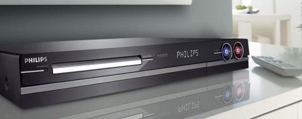 Philips DVDR5520H DVD/HDD Recorder on a glass table.