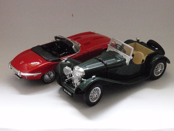 Two model cars photographed with a white background.Two model cars photographed on a white background.
