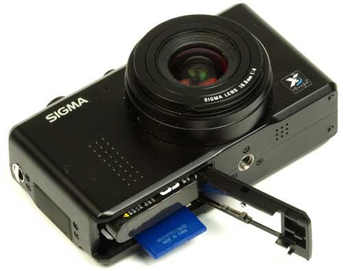 Sigma DP1 camera with open SD card slot.Sigma DP1 camera with an open memory card slot.