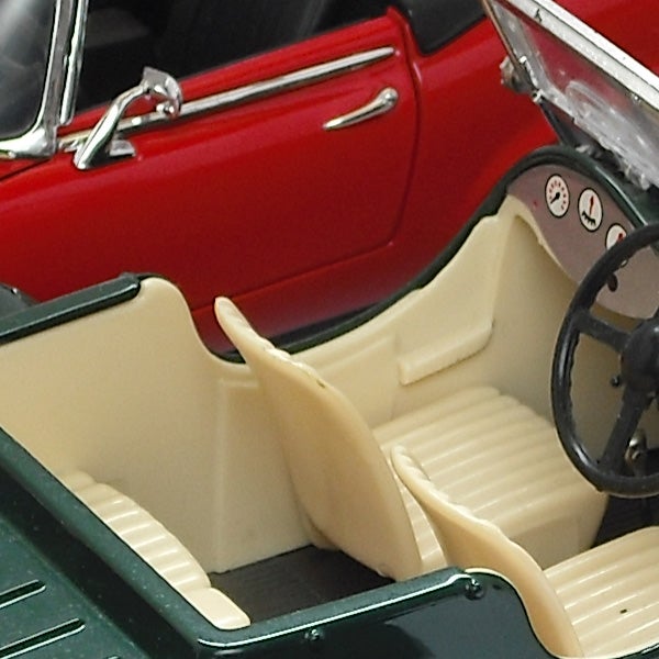 Close-up of a red toy car's interior detailing.Close-up of a classic car model interior detail.