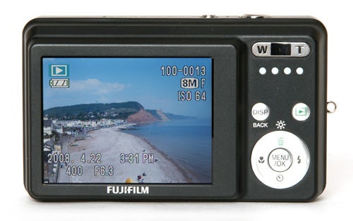 Fujifilm FinePix J10 camera displaying a beach scene image.Fujifilm FinePix J10 camera displaying a beach scene.