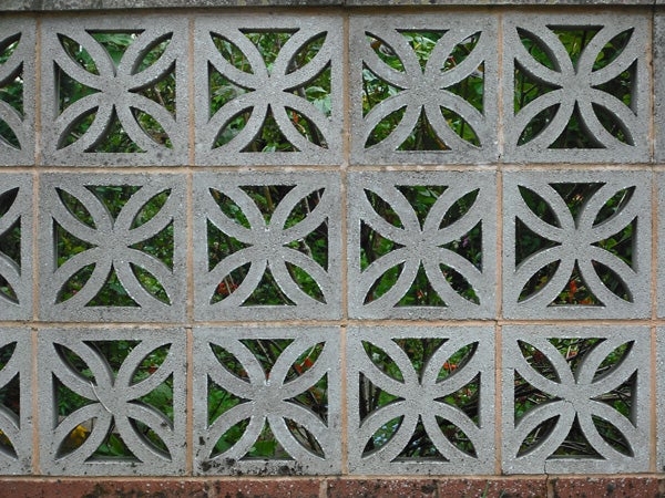 Decorative concrete block wall with geometric patterns.Decorative concrete block wall with floral patterns.