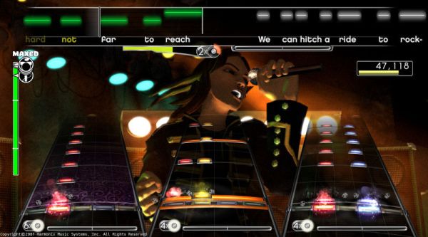Screenshot of Rock Band gameplay showing on-screen performance.Screenshot of Rock Band gameplay with vocalist avatar and score.