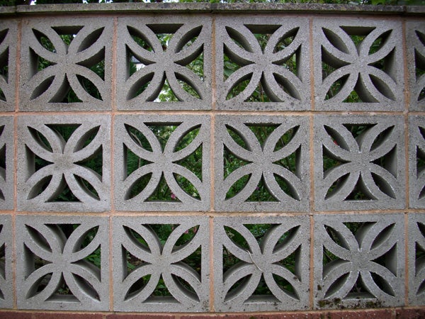 Decorative concrete block wall with geometric patterns.Decorative concrete wall with symmetrical patterns
