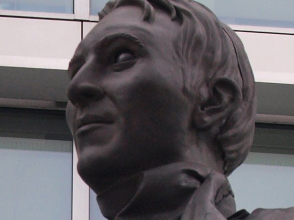 Close-up of a bronze statue's face.Close-up of a bronze statue head and shoulders.