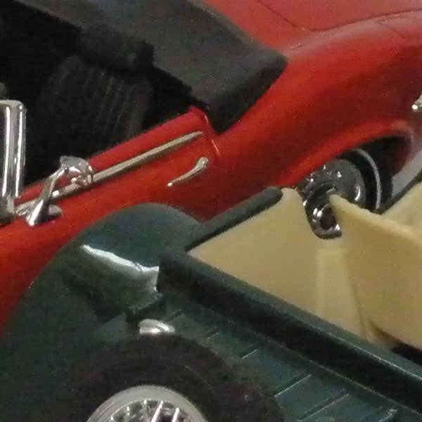 Close-up of a red toy convertible car.Close-up of a red toy car captured with Olympus FE-340.