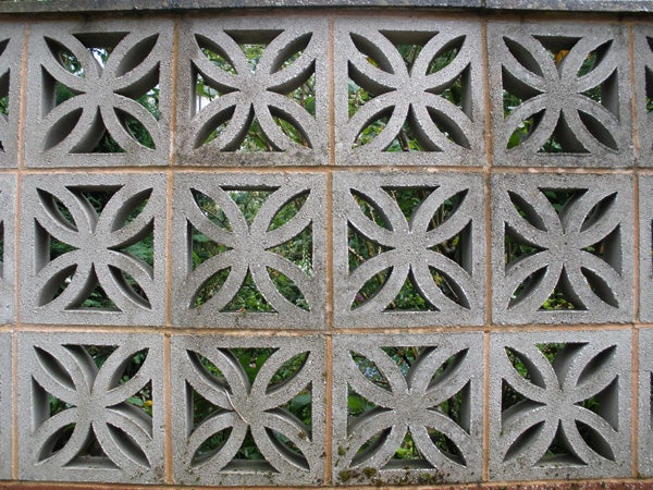 Decorative concrete block wall with floral patterns.Decorative concrete block wall with geometric patterns
