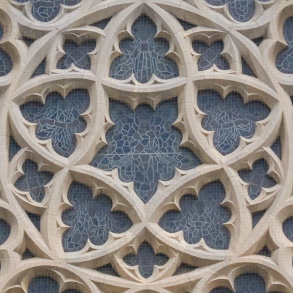 Intricate stone wall carving patterns.Intricate stone tracery on gothic architecture.