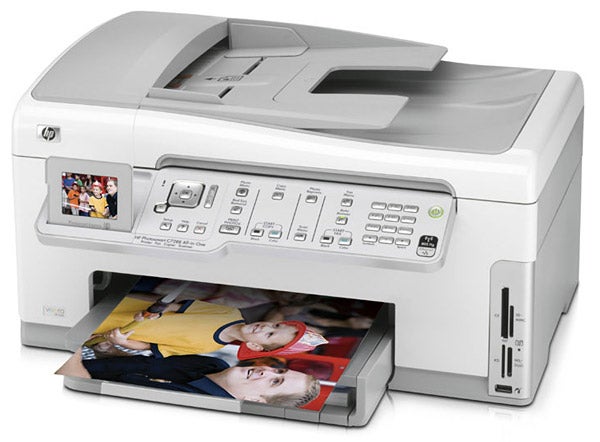HP Photosmart C7280 printer with printed photos.HP Photosmart C7280 All-in-One Inkjet Printer with printed photo.