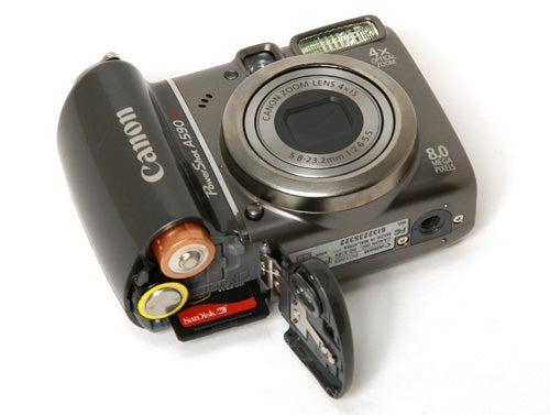 Canon PowerShot A590 IS camera with battery compartment open.