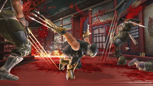 Ninja Gaiden 2 gameplay showing intense combat scene.Screenshot of Ninja Gaiden 2 combat scene with blood effects.