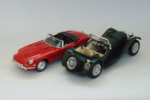 Two vintage model cars photographed with Sony Alpha A350.Red and green model cars photographed with Sony Alpha A350.