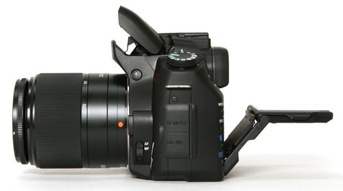 Sony Alpha A350 DSLR camera with lens and articulated screen.Sony Alpha A350 DSLR camera with lens and flipped-out screen.