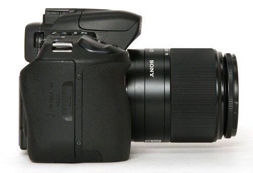 Sony Alpha A350 DSLR camera with lens attached.Sony Alpha A350 DSLR camera with lens on white background.
