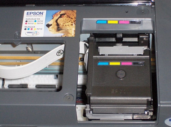 Open Epson Stylus D92 inkjet printer showing ink cartridges.Epson Stylus D92 Inkjet printer with open cartridge compartment.