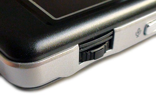 Close-up of Asus M530W smartphone's side and memory card slot.