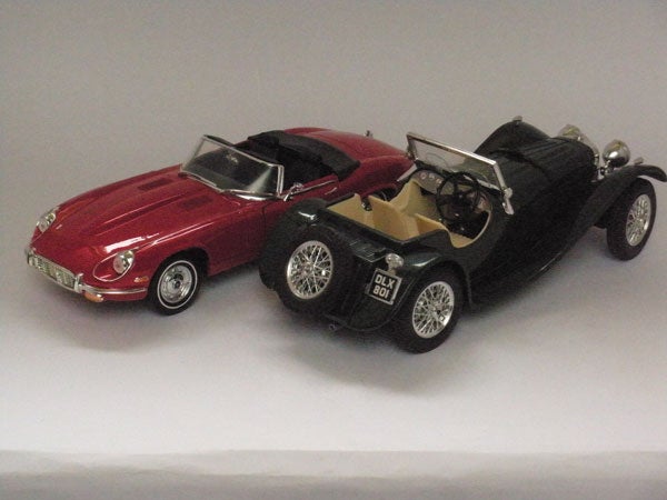 Two vintage model cars photographed on a white backgroundPhoto of two model cars taken with Nikon CoolPix S550.
