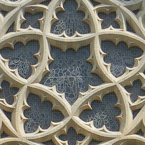 Decorative stone filigree pattern on a building facade.Decorative stone lattice work with intricate patterns
