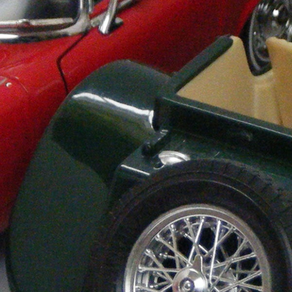 Vintage cars displayed in a showroom.Close-up of vintage toy cars on display