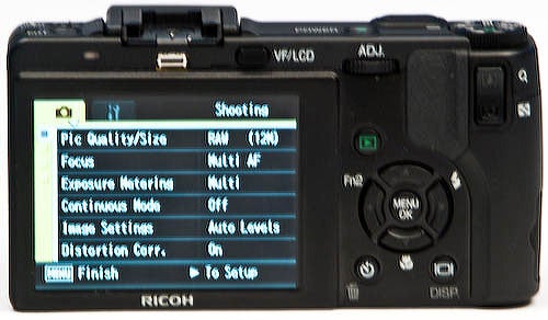 Ricoh GX200 camera displaying settings on its LCD screen.Ricoh GX200 camera showing its LCD screen menu options.
