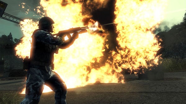 Soldier firing gun with large explosion in background from game.Screenshot of Battlefield: Bad Company gameplay with explosion.