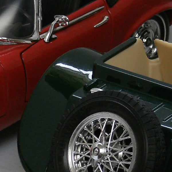 Close-up of two vintage toy cars.Close-up of vintage toy cars with detailed design
