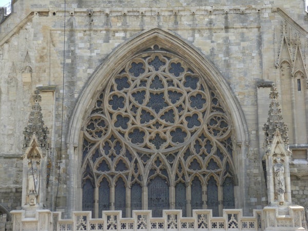 Detailed photo of a gothic cathedral's rose window.Gothic church window architecture detail photograph.