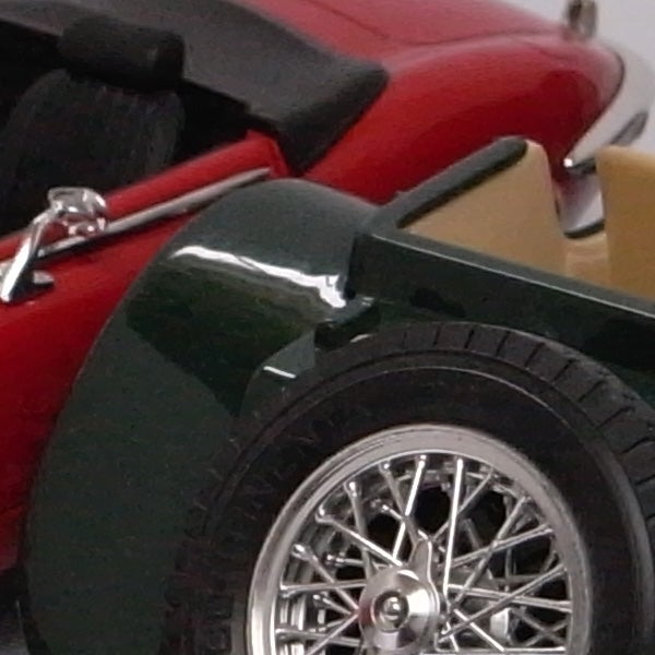 Close-up image of a toy car wheel and fenderClose-up of a toy car wheel and body detail.