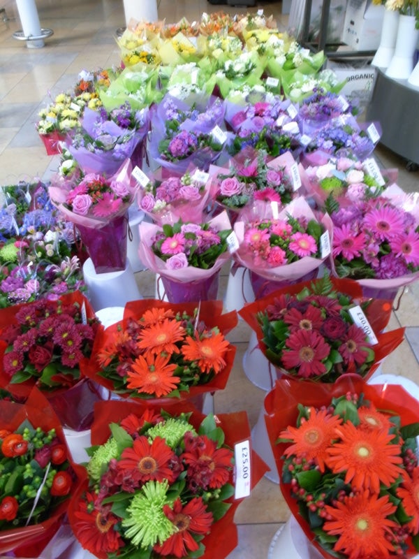 Colorful bouquets of flowers at a market display.Colorful flower bouquets display in a market.