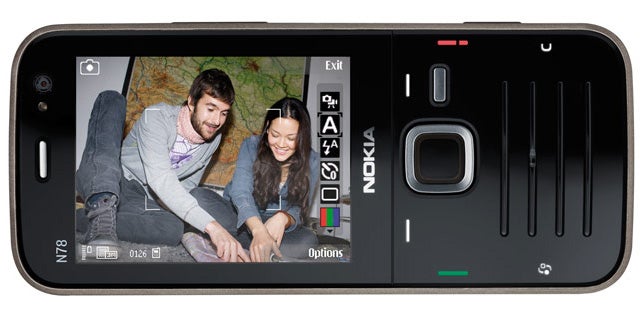 Nokia N78 smartphone displaying a photo on screen.Nokia N78 showing photo of two people on screen.