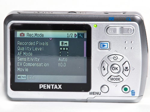 Pentax Optio E50 digital camera back view showing LCD screen.Pentax Optio E50 camera displaying menu on LCD screen.
